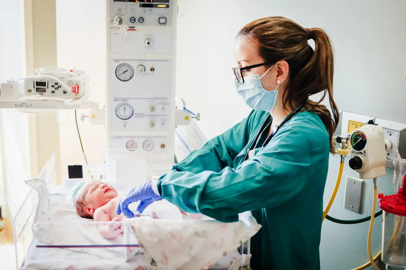 Clinical team caring for a newborn in labor and delivery