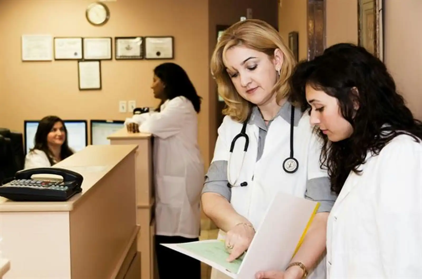 Medical office team reviewing patient care coordination