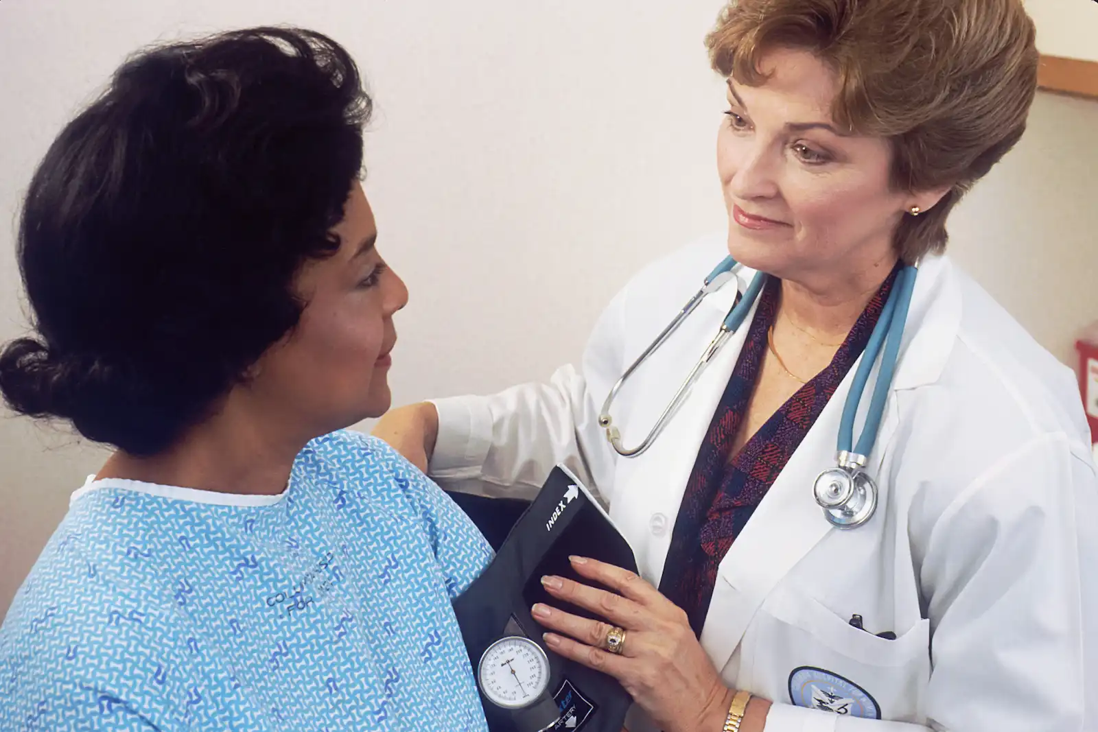 Physician conducting a pre-procedure evaluation with a patient