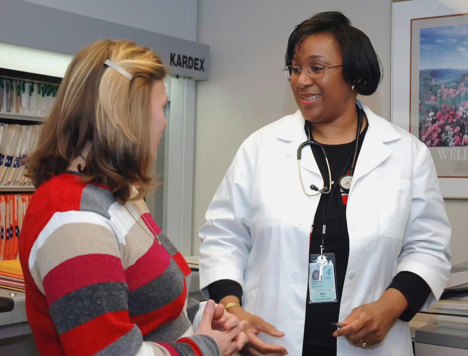 Anesthesia provider consulting with a patient before their procedure